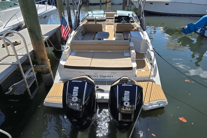 Slide: The Image of 2024 Sea Ray SDX 290 Outboard boat docked, featuring dual Mercury 250 engines. - 10