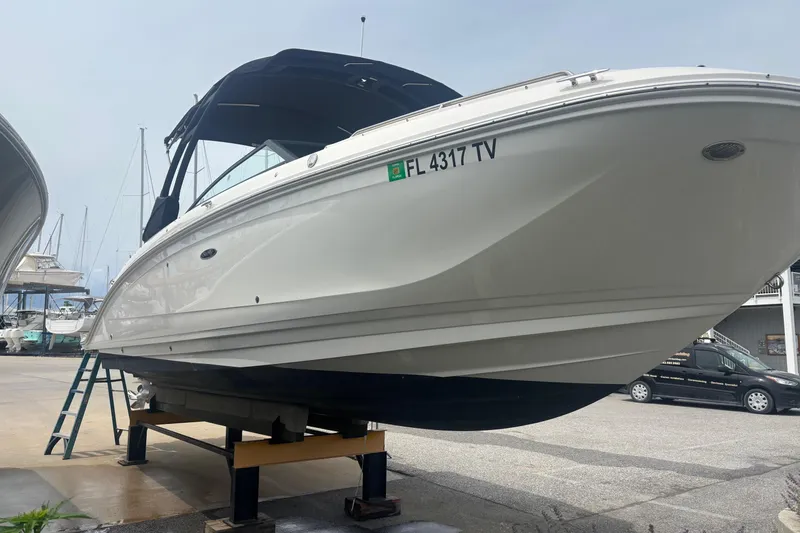Slide: The Image of 2024 Sea Ray SDX 290 Outboard boat on dry dock, side view. - 14
