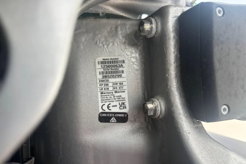 Slide: The Image of Label on 2024 Sea Ray SDX 290 Outboard engine, displaying model and serial numbers. - 16