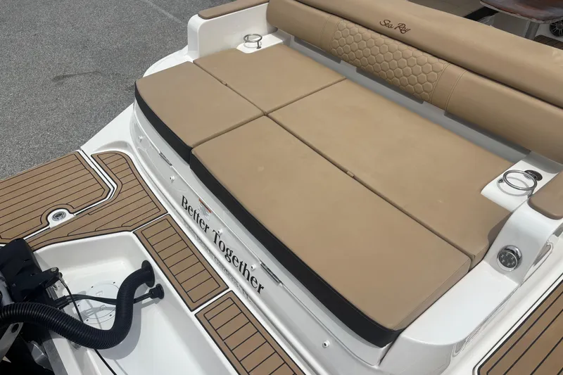 Slide: The Image of 2024 Sea Ray SDX 290 Outboard boat with tan seating and teak-style flooring. - 24
