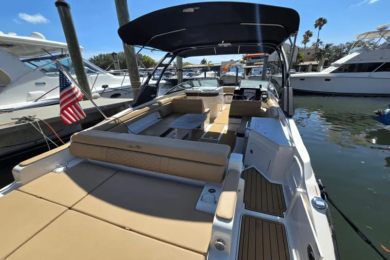 Slide: The Image of 2024 Sea Ray SDX 290 Outboard boat docked, featuring spacious seating and elegant design. - 7