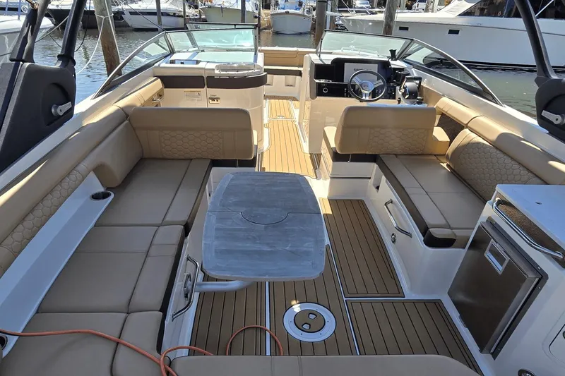 Slide: The Image of 2024 Sea Ray SDX 290 Outboard boat interior with luxurious seating and modern amenities. - 8