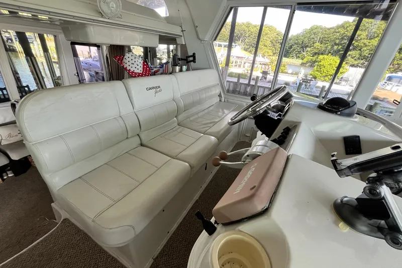 Slide: The Image of Interior of 1997 Carver 500 Cockpit Motor Yacht with helm and seating area. - 14
