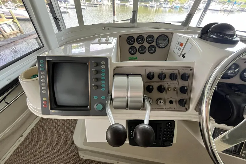 Slide: The Image of Control panel of a 1997 Carver 500 Cockpit Motor Yacht with navigation equipment. - 20