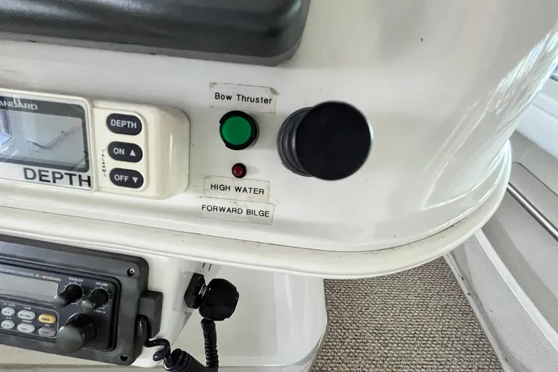 Slide: The Image of Control panel of a 1997 Carver 500 Cockpit Motor Yacht with depth gauge and bow thruster. - 22