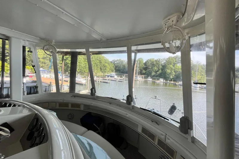 Slide: The Image of Interior view of 1997 Carver 500 Cockpit Motor Yacht overlooking marina. - 25