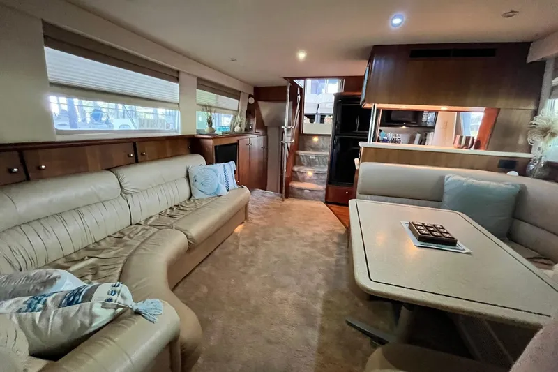 Slide: The Image of Luxurious interior of a 1997 Carver 500 Cockpit Motor Yacht with plush seating and elegant decor. - 36