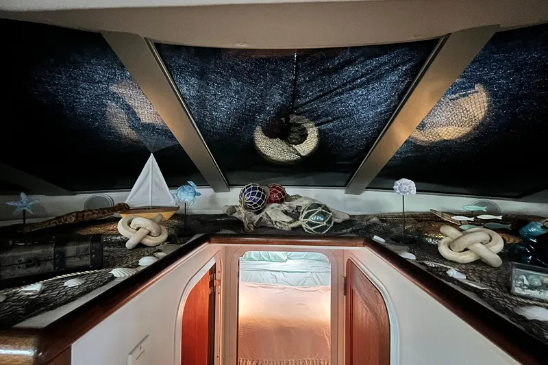 Slide: The Image of Interior of 1997 Carver 500 Cockpit Motor Yacht with nautical decor and skylights. - 38