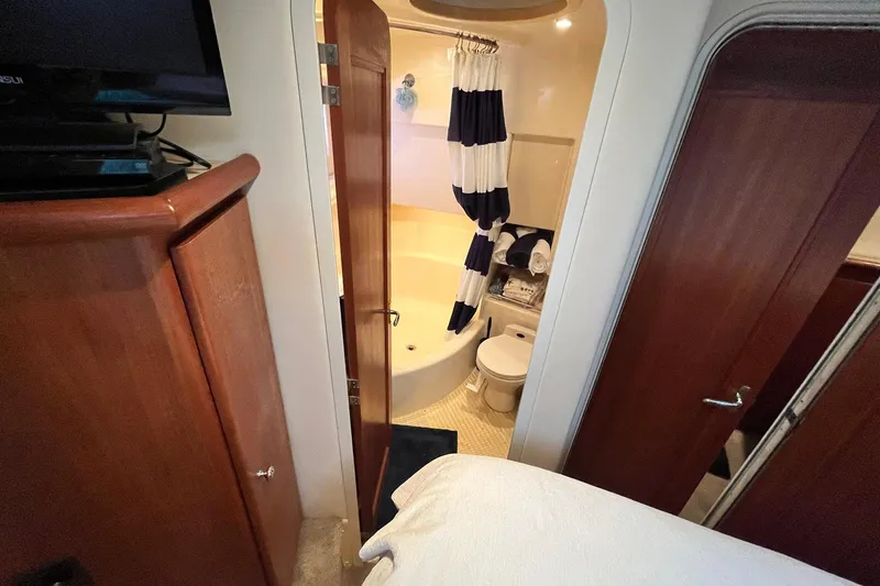Slide: The Image of Interior of 1997 Carver 500 Cockpit Motor Yacht bathroom with shower and toilet. - 41