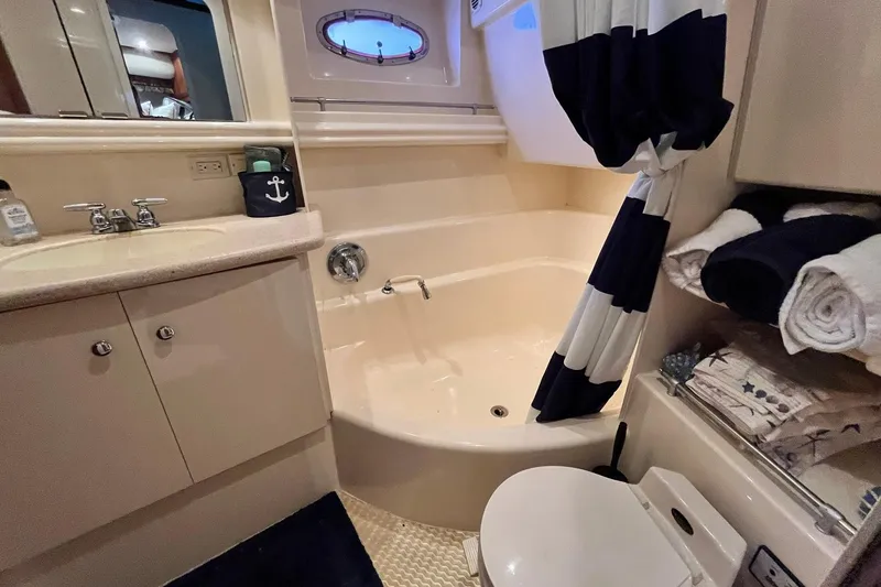 Slide: The Image of Bathroom interior of 1997 Carver 500 Cockpit Motor Yacht with shower and sink. - 43