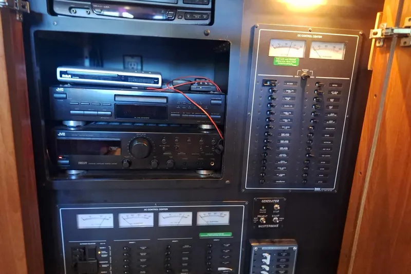 Slide: The Image of Control panel and audio equipment inside a 1997 Carver 500 Cockpit Motor Yacht. - 46