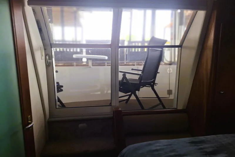 Slide: The Image of Interior view of 1997 Carver 500 Cockpit Motor Yacht with outdoor seating. - 52