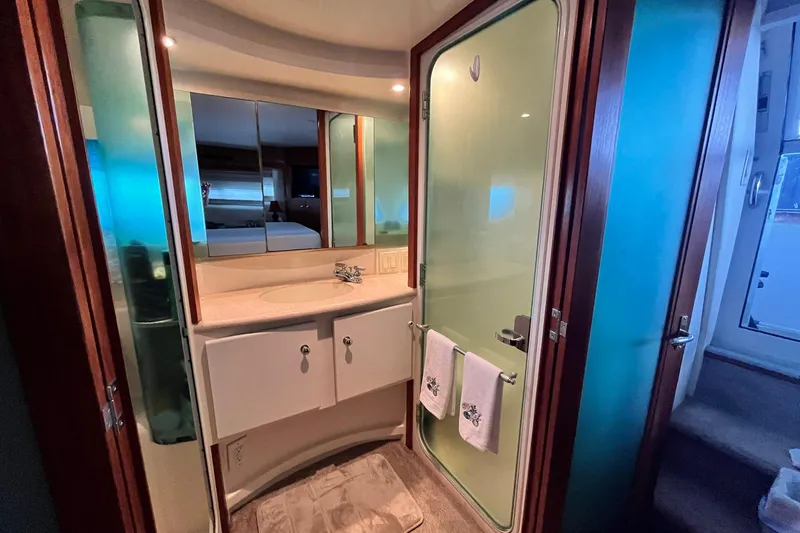 Slide: The Image of Bathroom interior of 1997 Carver 500 Cockpit Motor Yacht with glass shower door. - 53