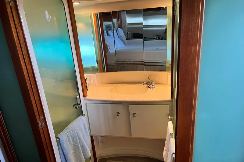 Slide: The Image of Bathroom interior of 1997 Carver 500 Cockpit Motor Yacht with sink and mirror. - 54