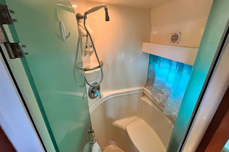 Slide: The Image of Shower area in 1997 Carver 500 Cockpit Motor Yacht with modern fixtures. - 55