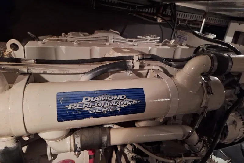 Slide: The Image of Engine of 1997 Carver 500 Cockpit Motor Yacht, featuring Diamond Performance Series label. - 58