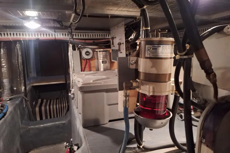 Slide: The Image of Engine room of 1997 Carver 500 Cockpit Motor Yacht with Racor fuel filter system. - 63