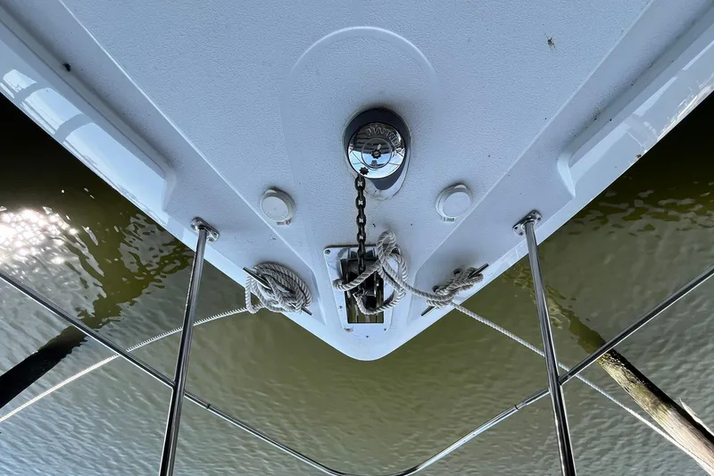 Slide: The Image of Bow view of 1997 Carver 500 Cockpit Motor Yacht with anchor chain and ropes. - 65