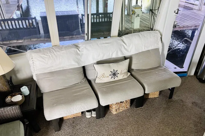 Slide: The Image of Interior of 1997 Carver 500 Yacht with cozy seating and nautical decor. - 7