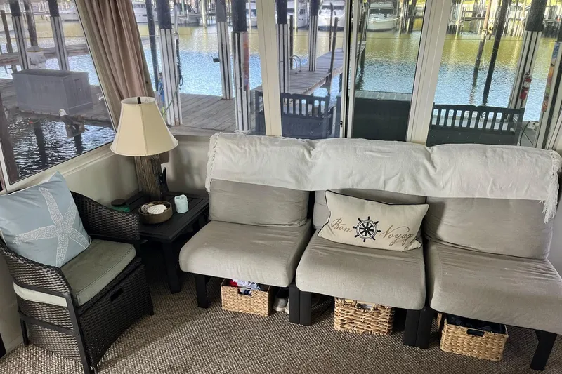 Slide: The Image of Cozy interior of a 1997 Carver 500 Cockpit Motor Yacht with comfortable seating and nautical decor. - 8