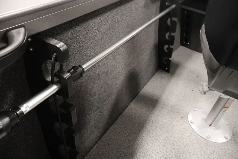 Slide: The Image of Interior of 2026 Crestliner 1650 Hawk WT boat showing rod holder and seating. - 34