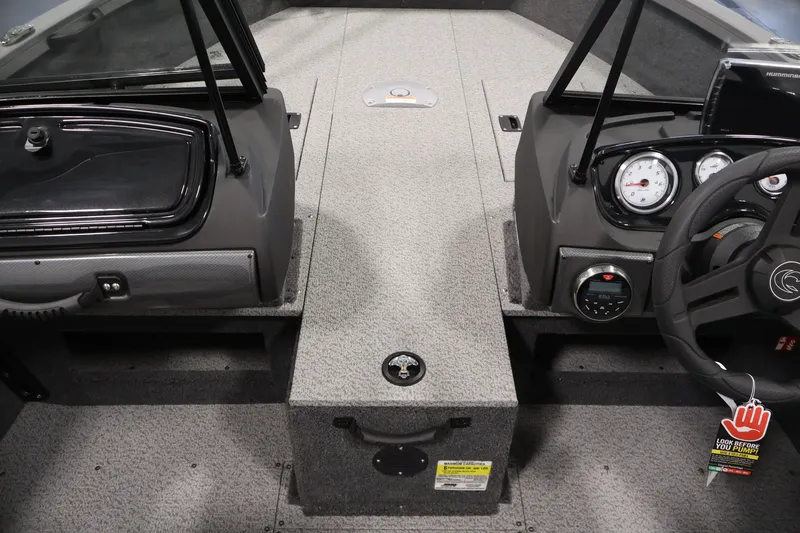 Slide: The Image of 2026 Crestliner 1650 Hawk WT boat interior with steering wheel and dashboard controls. - 25