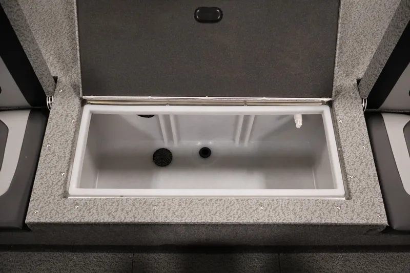Slide: The Image of Open storage compartment in 2026 Crestliner 1650 Hawk WT boat interior. - 42