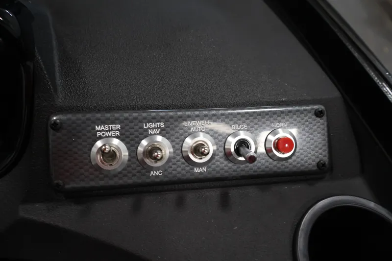 Slide: The Image of Control panel of 2026 Crestliner 1650 Hawk WT boat with switches and buttons. - 34