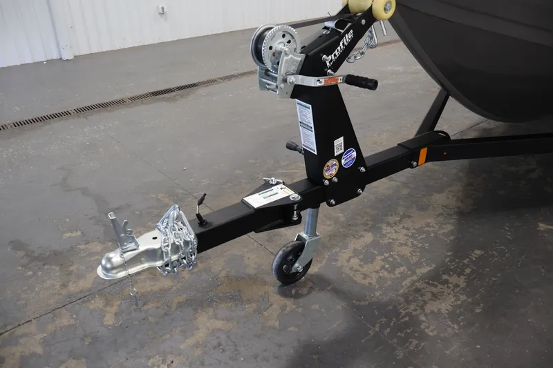 Slide: The Image of Trailer hitch of 2026 Crestliner 1650 Hawk WT boat, featuring sturdy construction and safety chains. - 48