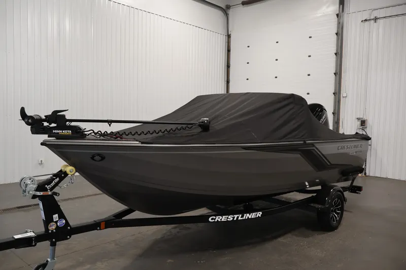 Slide: The Image of 2026 Crestliner 1650 Hawk WT boat with cover in a garage setting. - 51