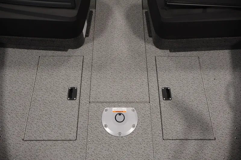 Slide: The Image of 2026 Crestliner 1650 Hawk WT boat interior with storage compartments and textured flooring. - 23