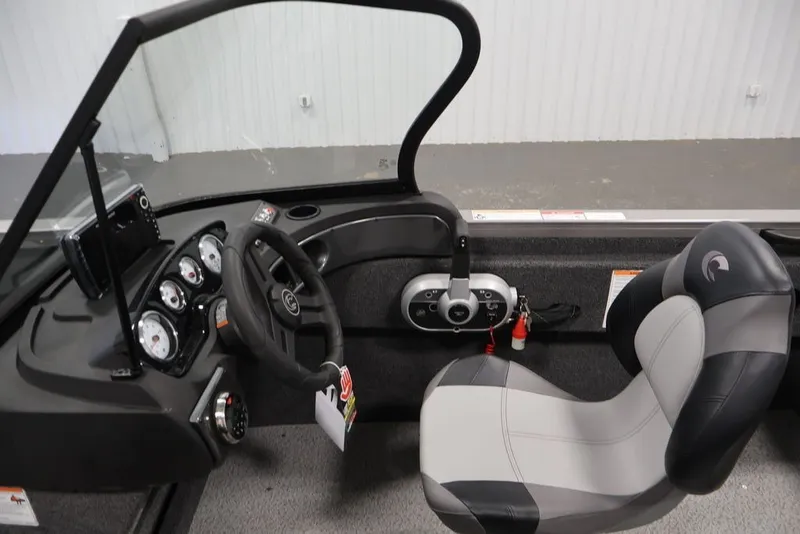 Slide: The Image of Interior of 2026 Crestliner 1650 Hawk WT boat, featuring steering wheel and control panel. - 22