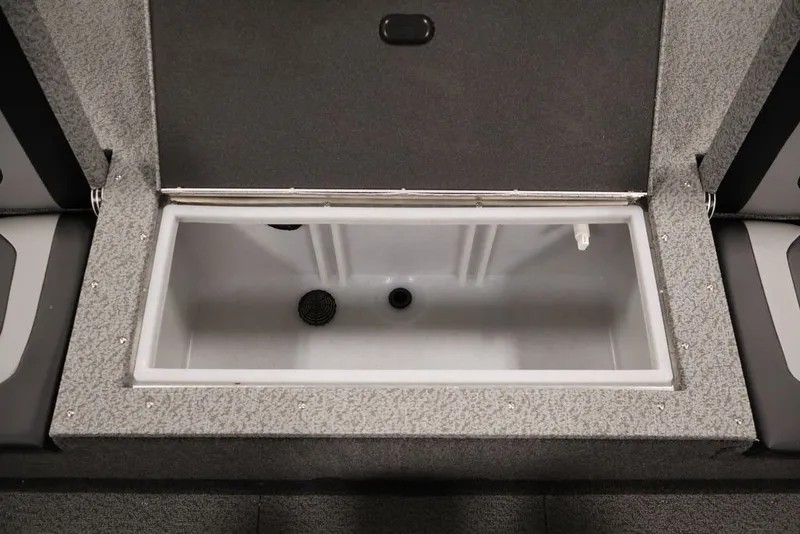 Slide: The Image of Open storage compartment in 2026 Crestliner 1650 Hawk WT boat interior. - 44