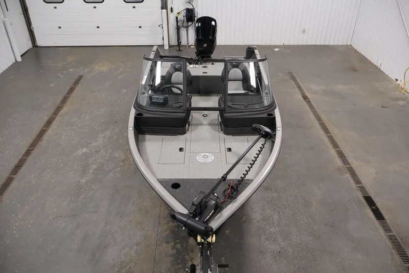 Slide: The Image of 2026 Crestliner 1650 Hawk WT fishing boat in a garage setting. - 21
