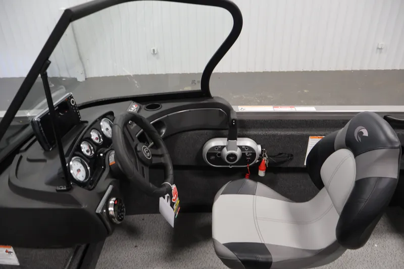 Slide: The Image of Interior view of 2026 Crestliner 1650 Hawk WT boat cockpit with steering wheel and gauges. - 28
