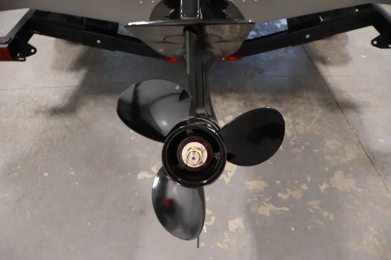 Slide: The Image of Propeller of 2026 Crestliner 1650 Hawk WT boat on display in a showroom. - 47