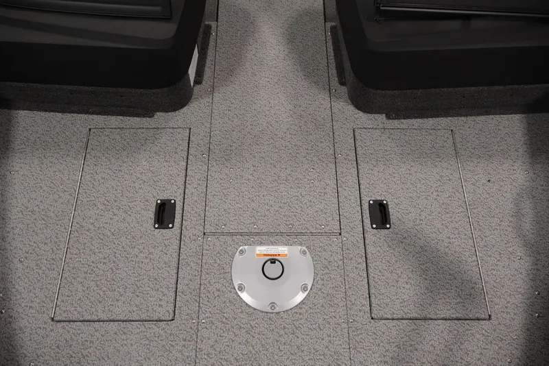 Slide: The Image of 2026 Crestliner 1650 Hawk WT boat interior with storage compartments and textured flooring. - 36