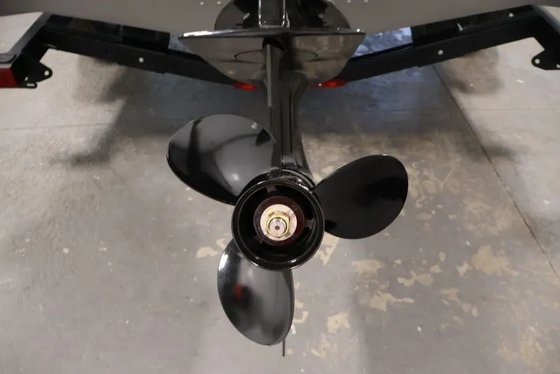 Slide: The Image of Propeller of 2026 Crestliner 1650 Hawk WT boat on a trailer. - 49