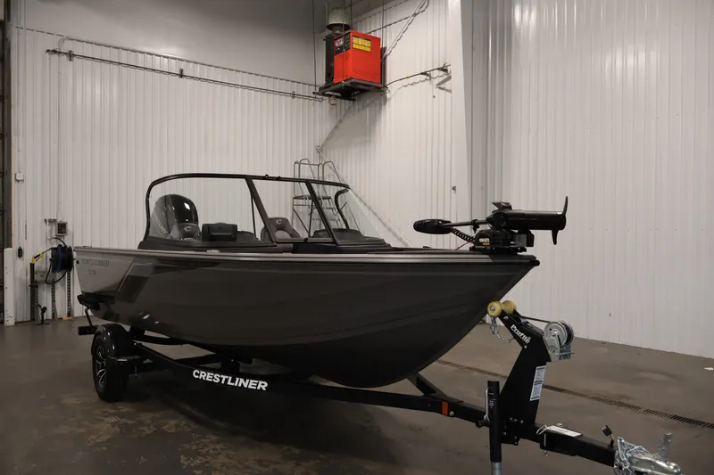 Slide: The Image of 2026 Crestliner 1650 Hawk WT boat in a garage setting. - 11