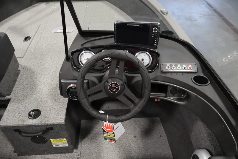 Slide: The Image of 2026 Crestliner 1650 Hawk WT boat dashboard with steering wheel and navigation system. - 29