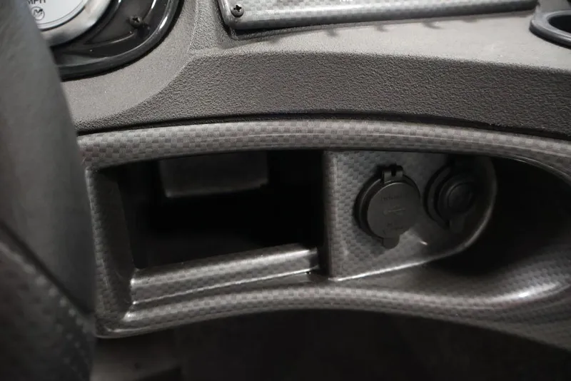 Slide: The Image of Dashboard of 2026 Crestliner 1650 Hawk WT with power outlets and textured finish. - 33