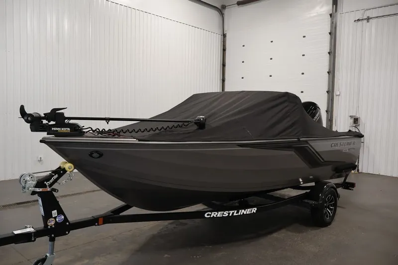 Slide: The Image of 2026 Crestliner 1650 Hawk WT boat with cover in a garage setting. - 51