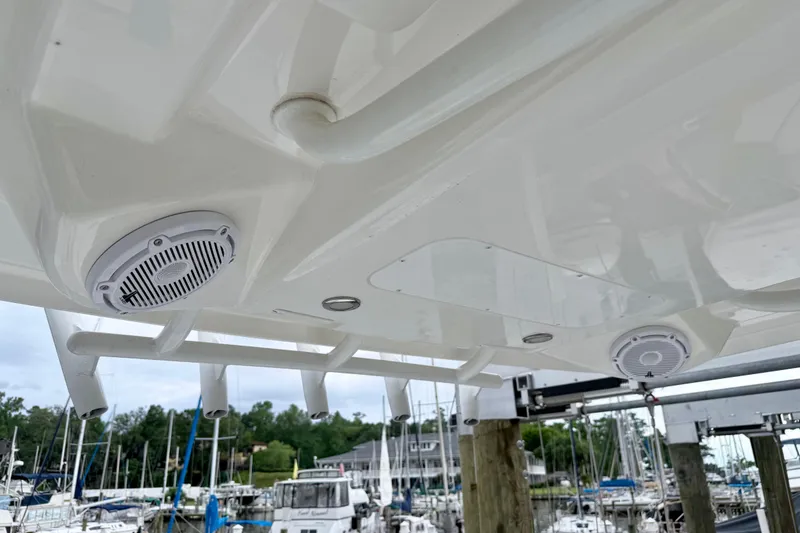 Slide: The Image of 2020 Regulator 24XO boat speakers and rod holders at marina. - 7