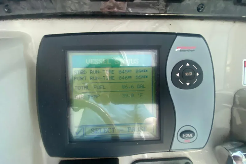 Slide: The Image of Display screen on 2007 Sea Ray 40 Sundancer showing vessel status and fuel data. - 12