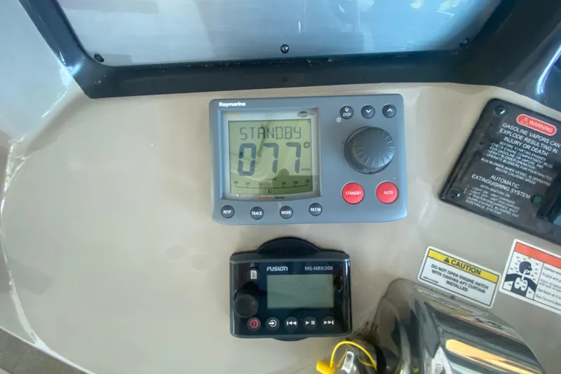 Slide: The Image of Control panel of a 2007 Sea Ray 40 Sundancer boat with navigation and warning displays. - 14