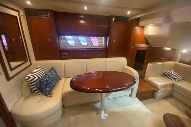 Slide: The Image of Luxurious interior of 2007 Sea Ray 40 Sundancer yacht with elegant seating and wooden table. - 17