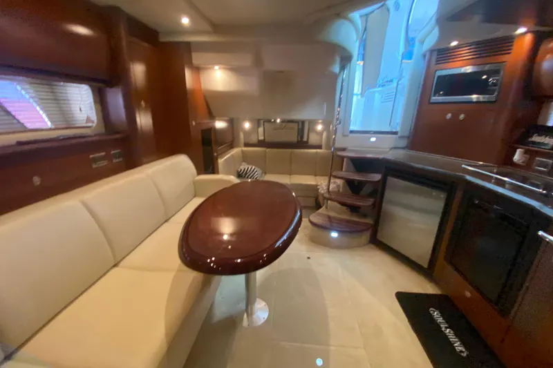 Slide: The Image of Luxurious interior of 2007 Sea Ray 40 Sundancer yacht with elegant seating and modern amenities. - 18