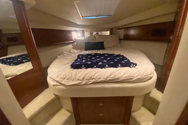 Slide: The Image of Luxurious cabin interior of 2007 Sea Ray 40 Sundancer yacht with cozy bedding. - 20