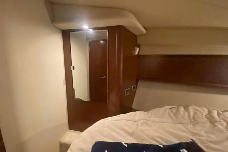 Slide: The Image of Interior cabin of 2007 Sea Ray 40 Sundancer yacht with mirror and bed. - 21