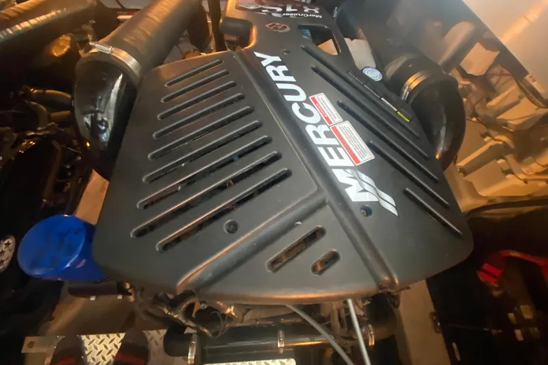 Slide: The Image of Engine compartment of a 2007 Sea Ray 40 Sundancer with Mercury components. - 26